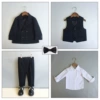 Black suit, vest, trousers, shirt, bow tie, maple leaf lapel pin