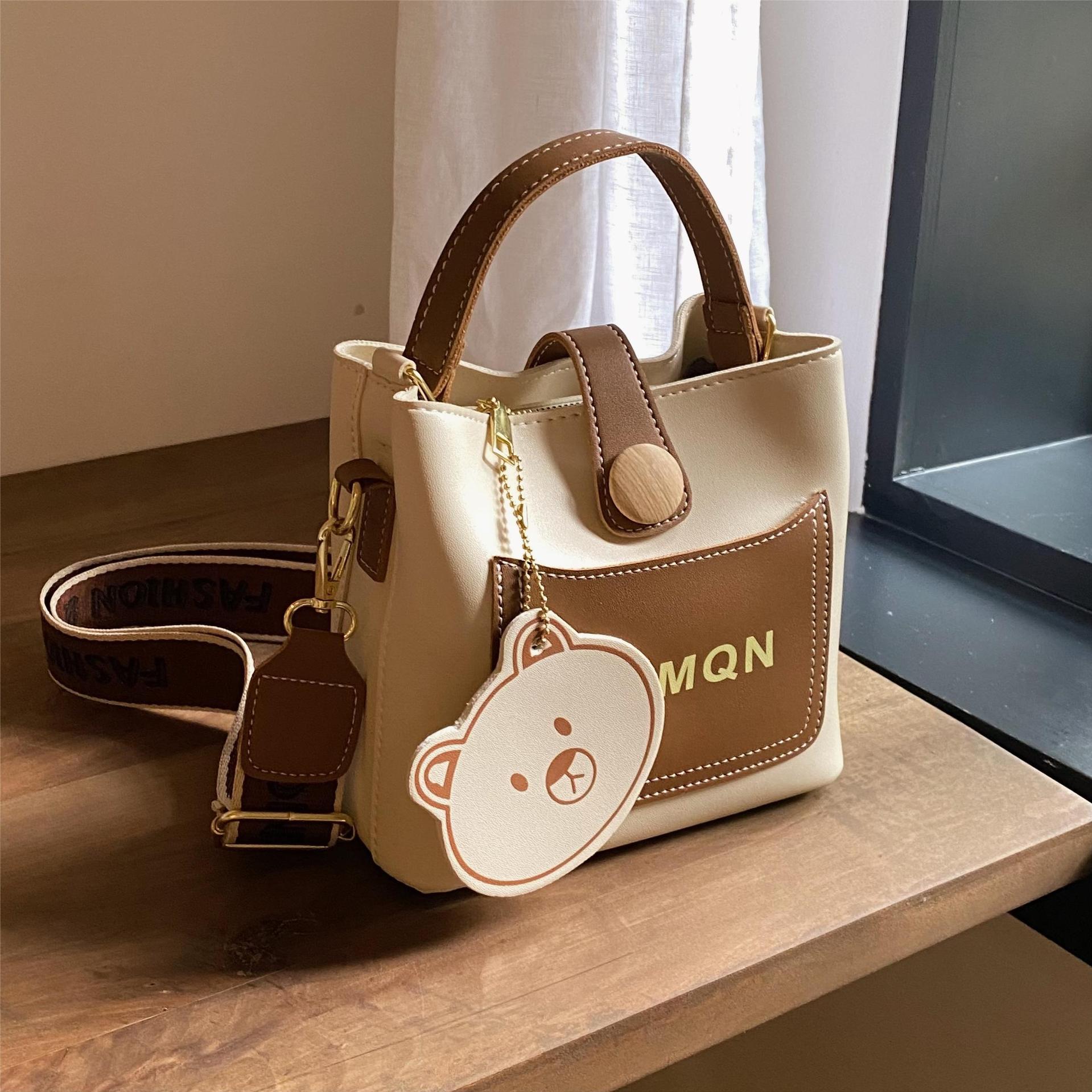 Diseño de nicho bolso a juego para mujeres 2023 nuevo popular bolsa de cubo bolsa de mensajero portátil de celebridades en línea de alta calidad