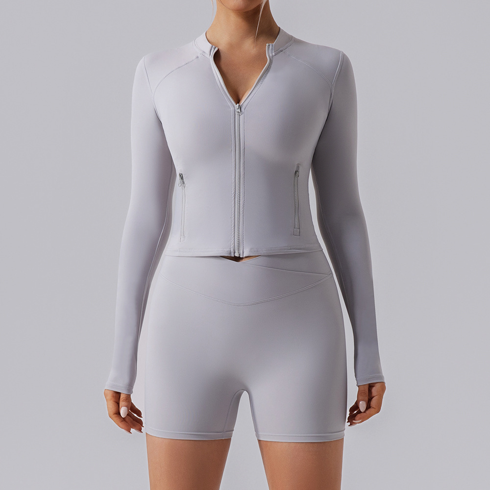 Europa y los Estados Unidos de alta elasticidad gimnasio camisa deportiva de mangas largas para mujeres delgada cardigan con cremallera apretada para correr chaqueta de yoga