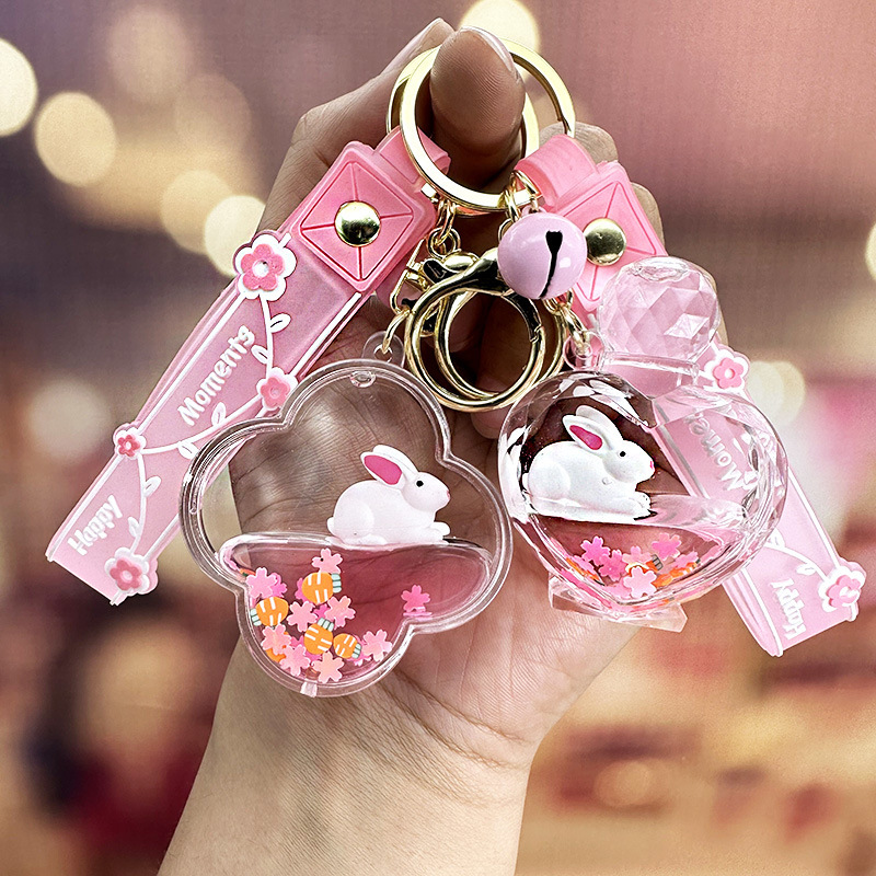 Colgante de llavero de conejo de botella de arena rosa, muñeca flotante creativa, decoración de mochila para niña, regalo exquisito para pareja