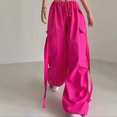 アメリカの街頭のバラのピンクのリボンの低い腰のゆったりした工装のズボンの個性の多いポケットのゴムの束の足のダンスのカジュアルなズボン