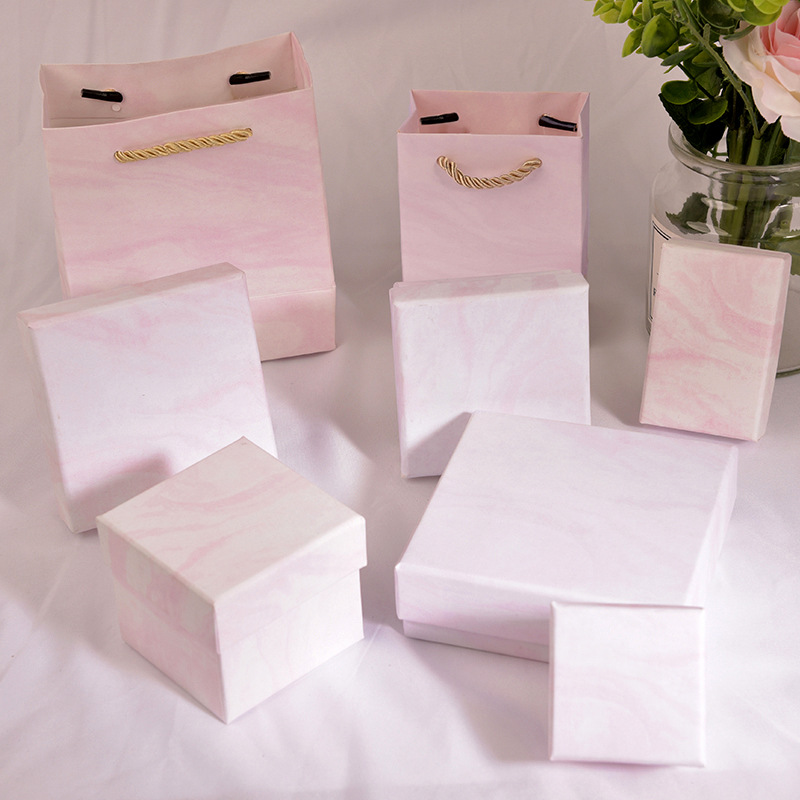 Thick pink marbled jewelry packaging box...