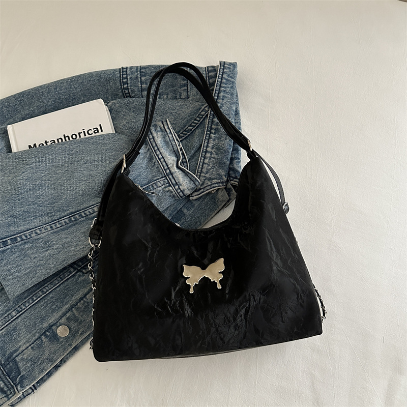 Mochila de moda de mariposa coreana 2024 nuevo bolso de mensajero de un solo hombro de cadena para estudiantes en clase bolso de alta capacidad