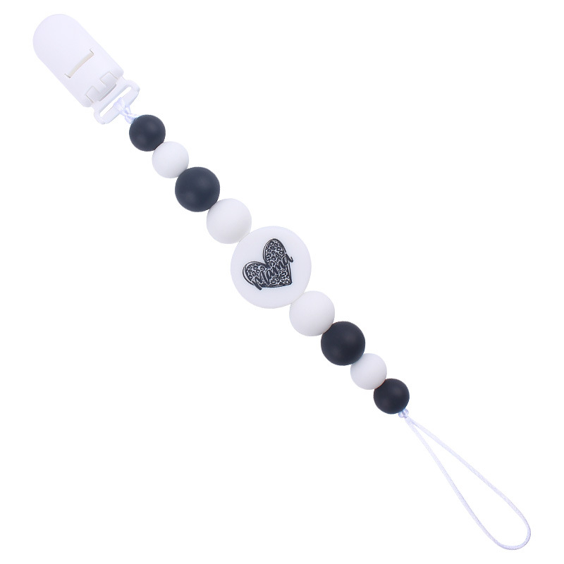 Nuevo bebé suministros de dibujos animados de impresión redonda amor creativo DIY silicona mordedura molar pezón cadena anti-caída