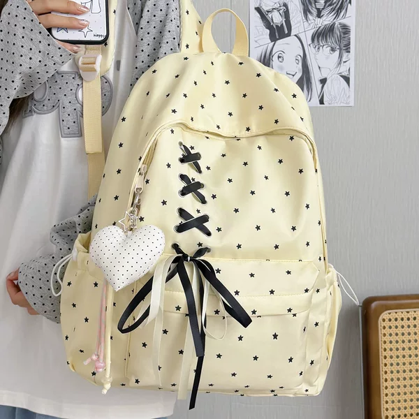 Highly stylish starry school backpack for junior high school girls, with bow tie, large capacity, trendy and unique, lightweight campus backpack
