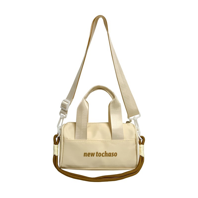 Bolsa de hombro casuales coreana para niños y niñas, letras extranjeras para bebés, bolsas portátiles de balde de agua 2025, nuevas bolsas de comercio exterior para niños