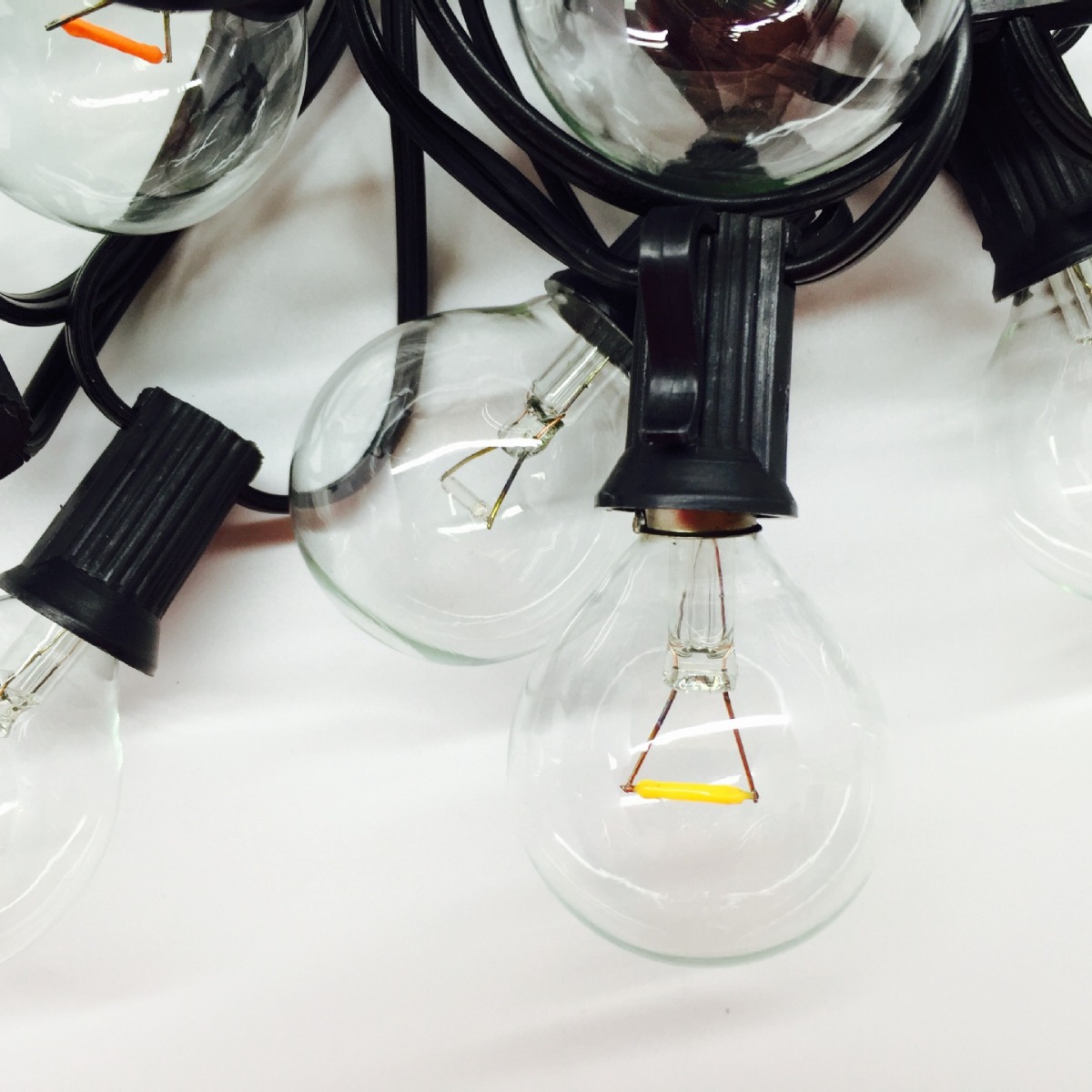 Venta directa de fábrica, luces decorativas de cadena LED G40 de cristal amarillo cálido de 120V para exteriores, impermeables, con función de atenuación