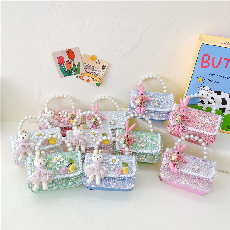Estilo coreano de los niños bolsa pequeña de Kindergarten niñas mini bolso 2023 nueva cadena de conejito de dibujos animados bolsa de hombro