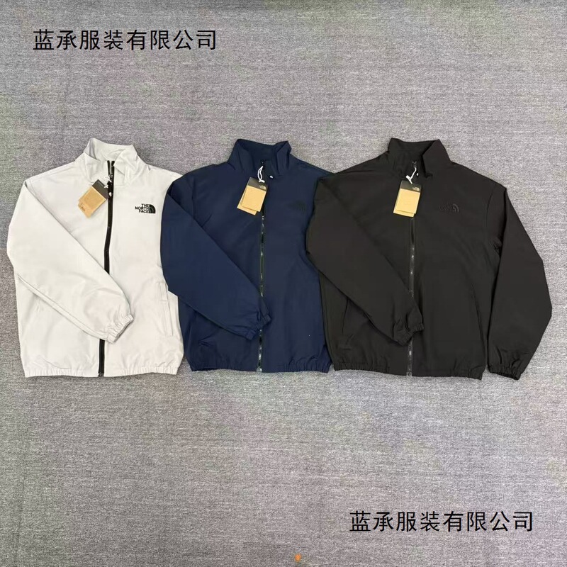 The North Face men's stand-up collar jacket, a new spring/autumn casual outerwear piece with a drawstring design and a sporty style The North Face men's stand-up collar jacket, a new spring/autumn casual outerwear piece with a drawstring design and a sporty style
