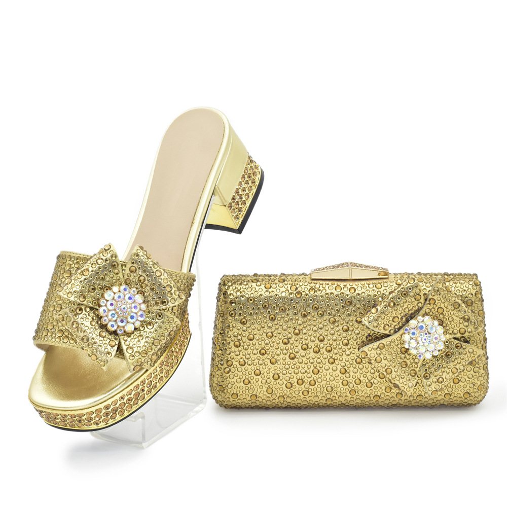 Accessorize the evening with applique studded high-heeled sandals and a full cloth small flash diamond dinner bag set with sandals_voghion.com