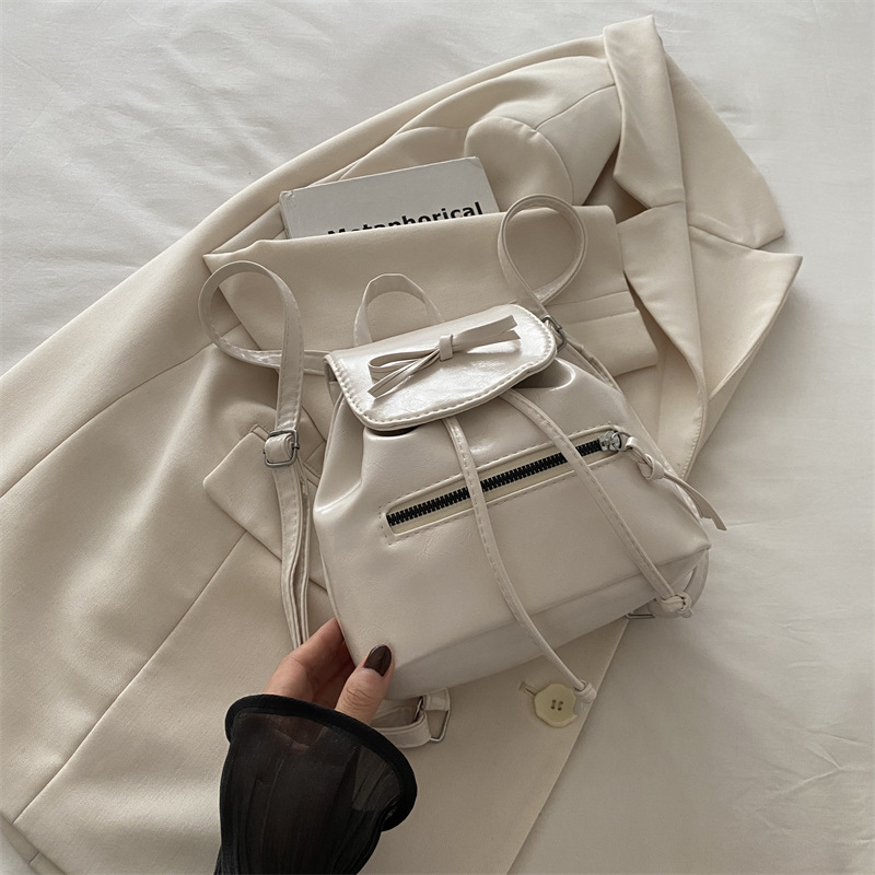 Mochila de nicho coreana para mujer, verano 2024, nueva mochila de moda, bolso de cubo portátil de un solo hombro de todo fósforo