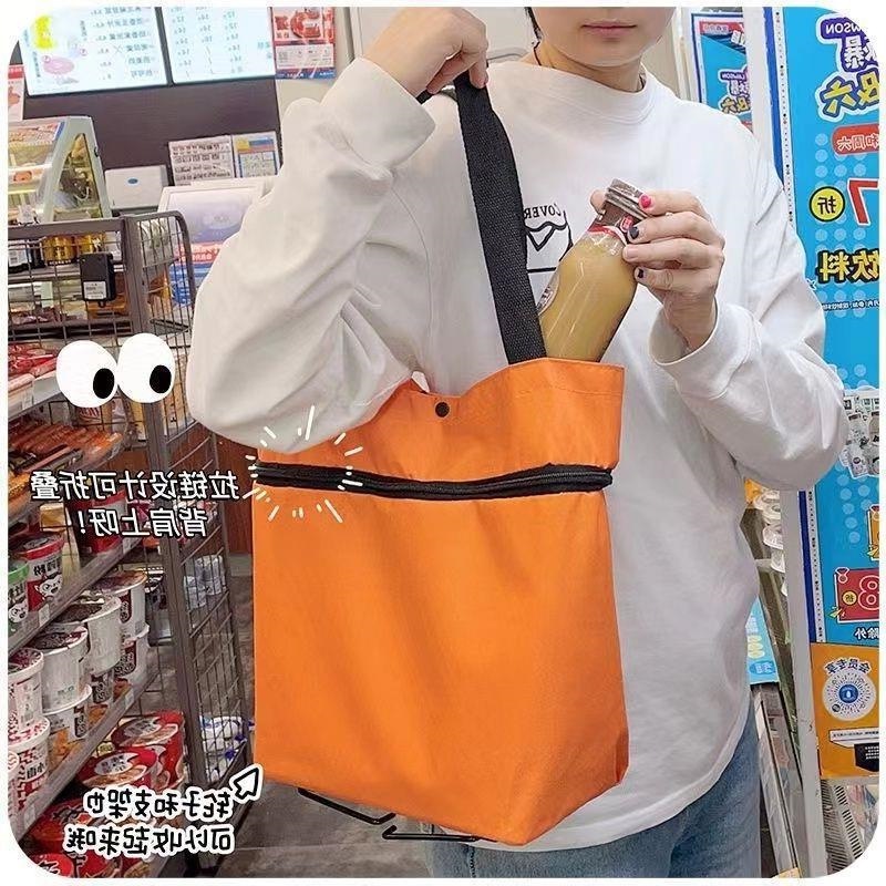 野菜を買う車のネットの赤いタイプの手引き車は携帯の車輪の手提げ袋の防水のスーパーマーケットのショッピングのカートを折り畳みます。|undefined