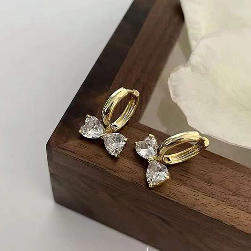 Pendientes de lazo de lazo de diamantes de estilo nuevo de estilo coreano, pendientes de lujo ligero y de alta gama, temperamento de viento frío femenino, pendientes de aguja plateada s925