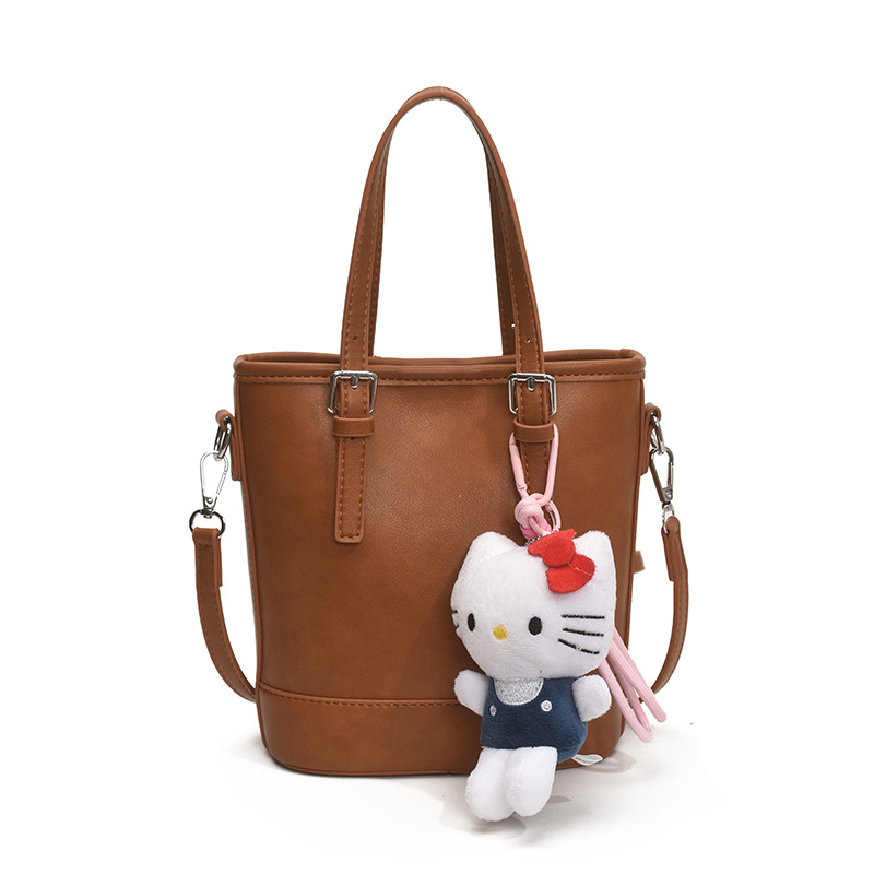 2025 nuevo bolso de cubo portátil de diseño de nicho bolso de hombro de viajero de todo fósforo de moda femenina bolso de mensajero de estilo occidental de color sólido