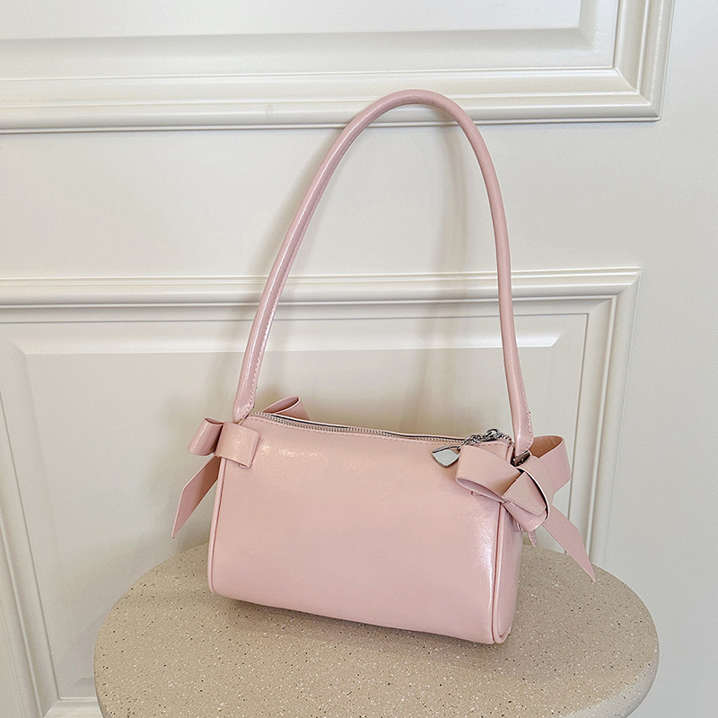 Bolsos de brazo de arco de arco de aire extranjero diarios para mujeres verano 2026 nuevo tipo de lujo ligero versátil bolso de hombro de viaje