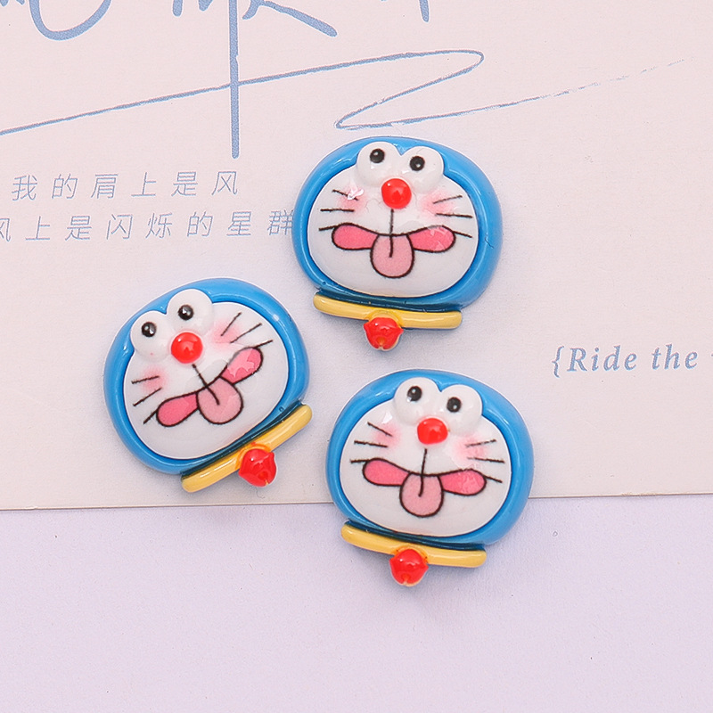 Dibujos animados lindo Jingdang gato expresión DIY caja del teléfono accesorios para el cabello crema pegamento material hecho a mano accesorios de resina al por mayor