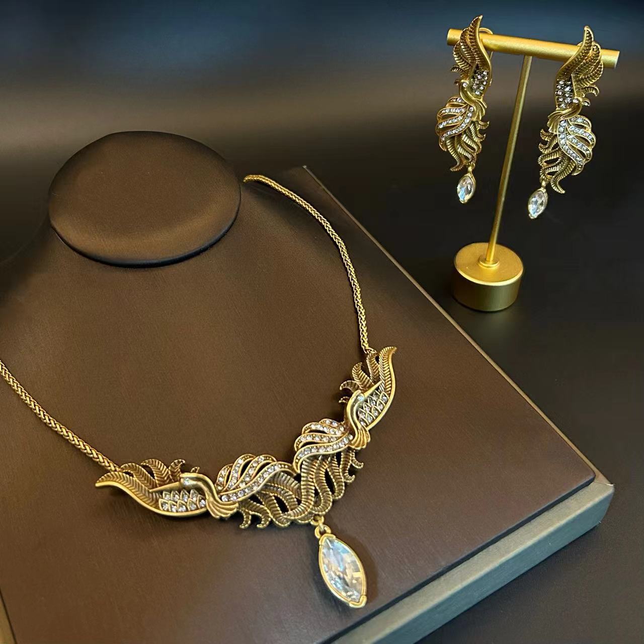 Set gioielli vintage collana e orecchini fenice con diamanti_voghion.com