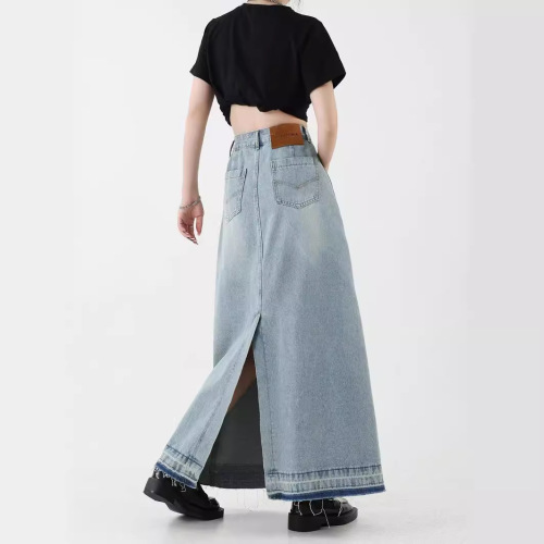 Vintage American design flared denim skirt for women, mini length, featuring frayed edges, high-waisted for a slimming effect, A-line style, suitable for spring.