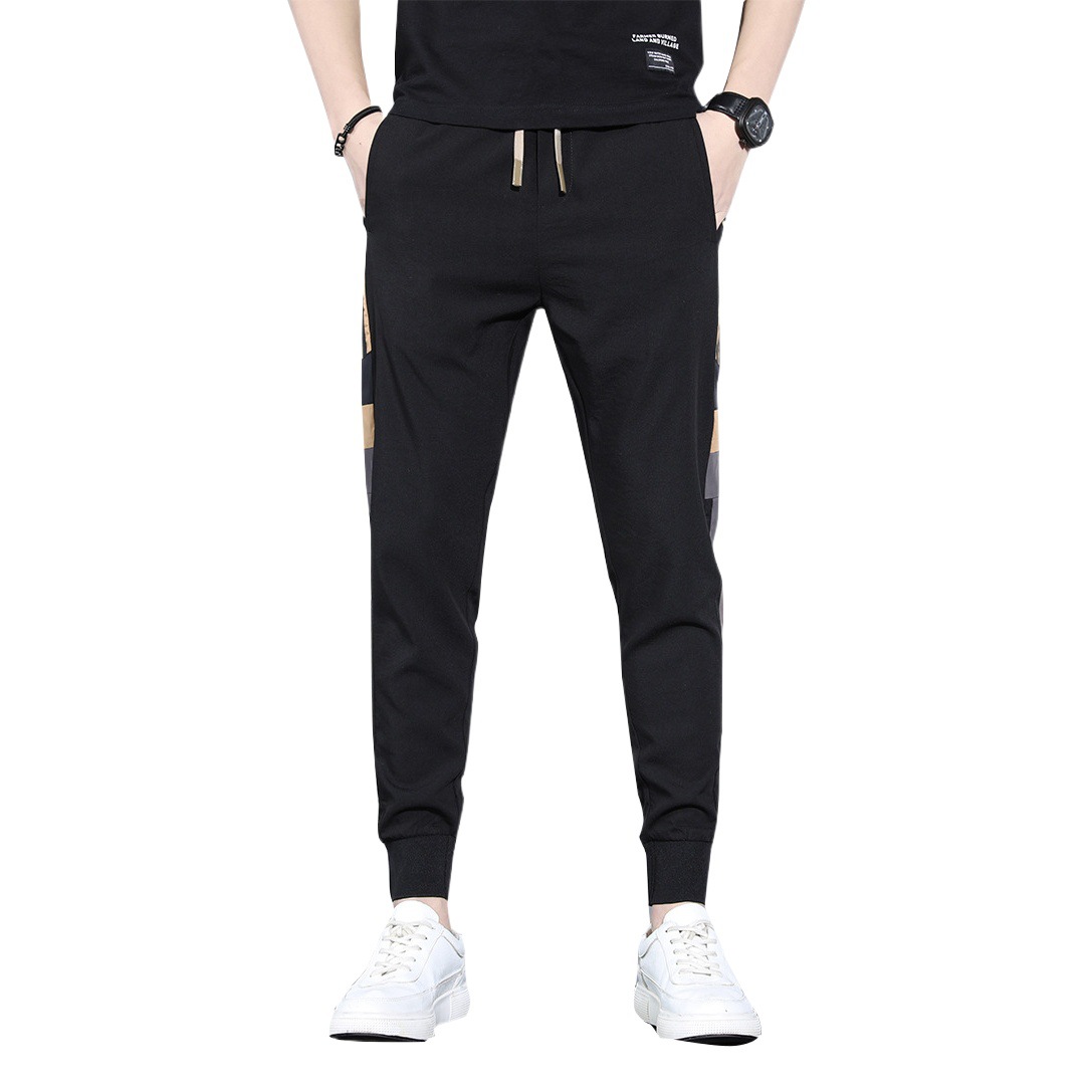 Pantalones deportivos de primavera y otoño sueltos para hombres 2023 nuevos pantalones largos casuales versátiles marca de moda de primavera pantalones harén atados al tobillo