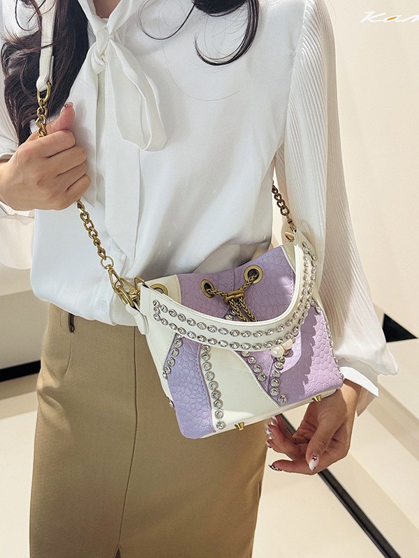 Bolso de cubo de comercio exterior mujer 2026 nuevo nicho transfronterizo ligero de lujo empalmado cadena de diamantes bolso de hombro