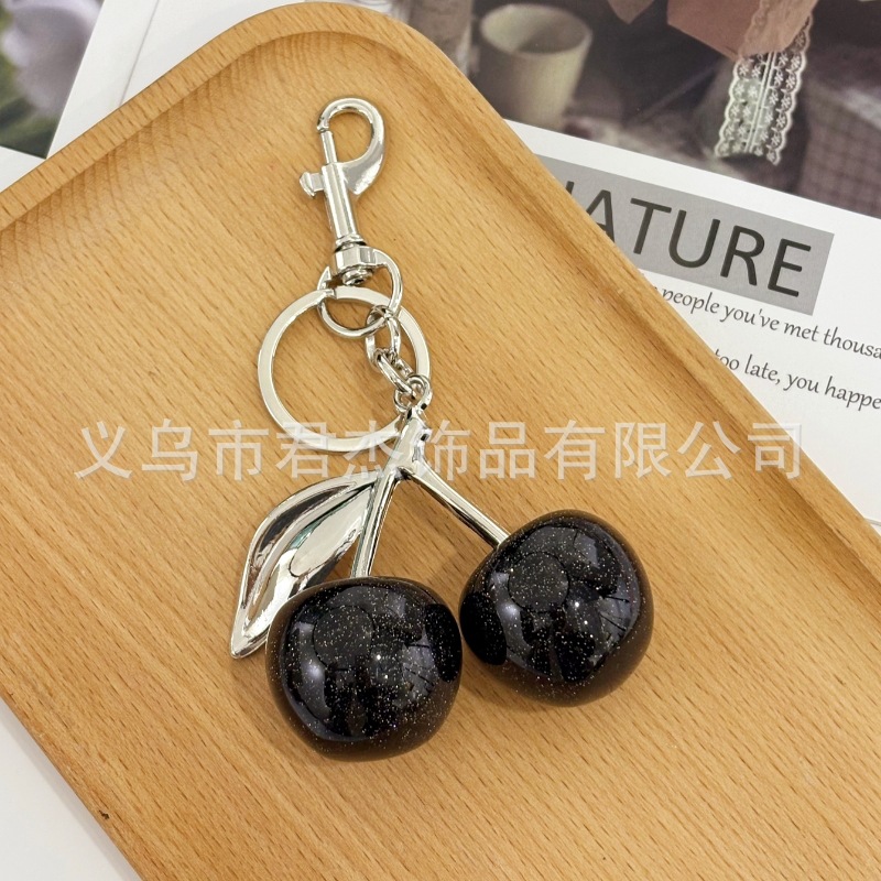 さくらんぼのキーホルダーアクセサリーのバッグのストラップがおしゃれで美しい水晶樹脂車センチ車のキーホルダーの女性