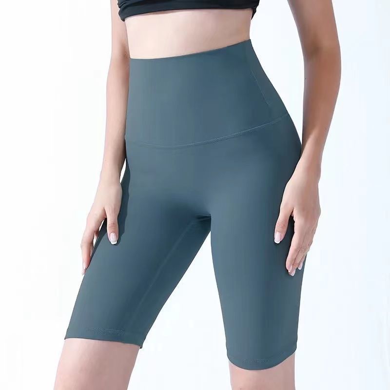 Pantalones cortos desnudos de mujer elásticos apretados para elevar las caderas de cinco puntos pantalones deportivos de secado rápido succión de sudor entrenamiento para correr fábrica de comercio de ping