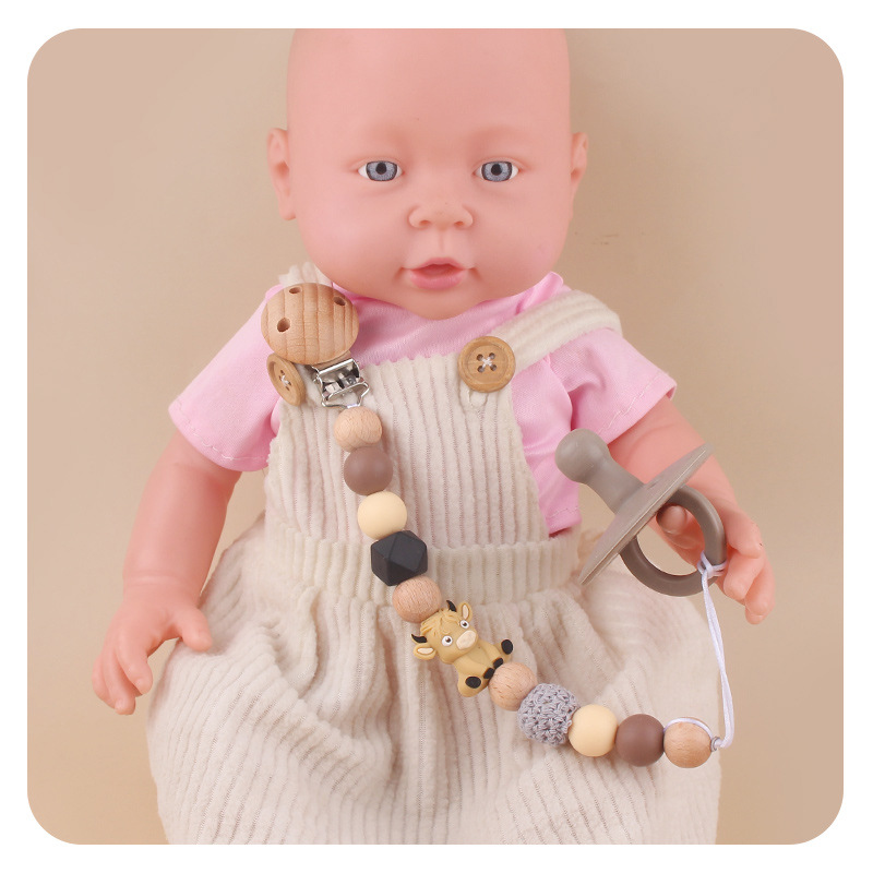 Productos para bebés abrazadera de chupeta de beech creativa caricatura estereoscópica buey silicona mordida de dientes molares cadena de chupeta de prevención