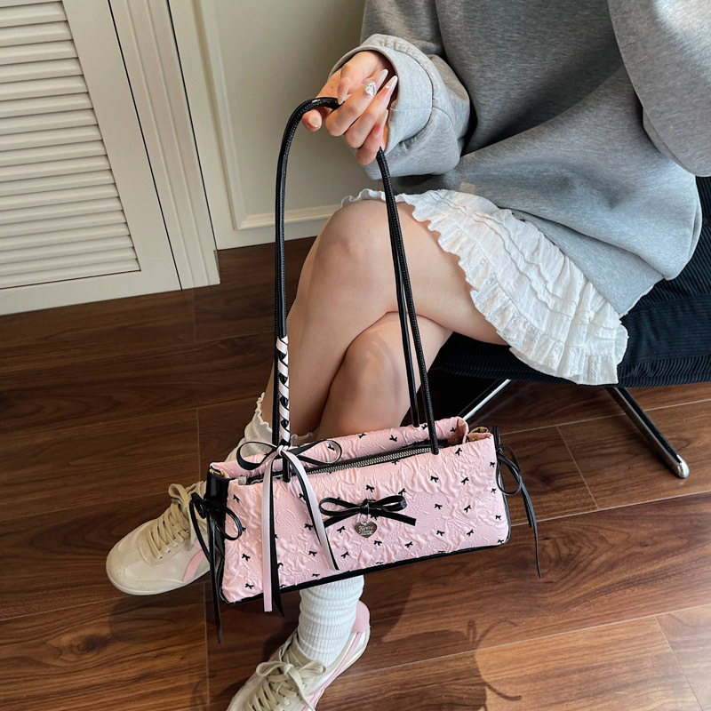 Bolso de axila de chica caliente fresco de moda 2025 verano nuevo bolso femenino lindo lazo bolso de hombro de color de contraste de estilo occidental
