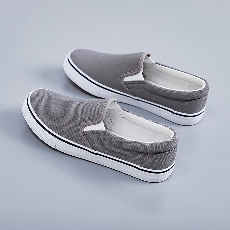 2025 zapatos de lona negros zapatos blancos perezosos un pedazo de primavera coreana para hombres y mujeres zapatos elásticos de estudiantes