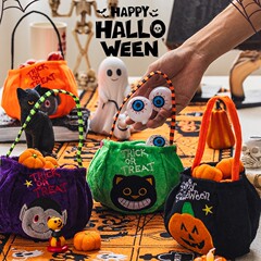 ハロウィーンのカボチャのバケツのキャンディーの袋のかごの子供の贈り物の贈り物は幼稚園の雰囲気を飾って飾っています。