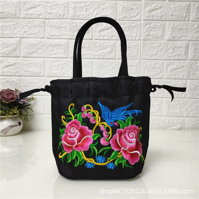 2024 nuevo estilo étnico bordado bolsa bordada bolsa de lona Cambio de teléfono móvil con cordón bolsa pequeña bolsa de cubo de la señora