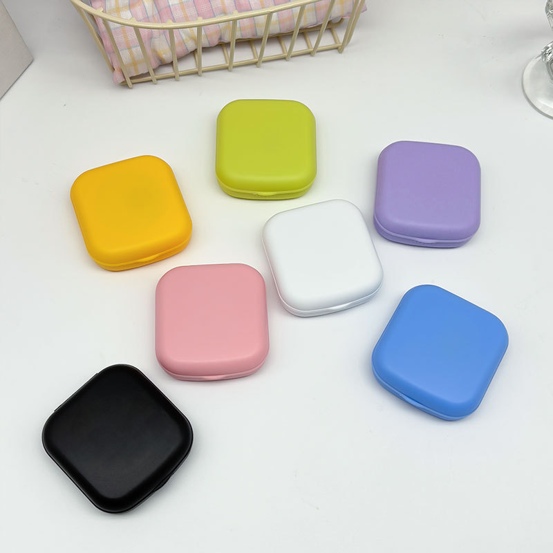Nueva caja de lentes de contacto de color caramelo con espejo, caja de lentes de contacto de belleza de color sólido pequeña y portátil, caja de cuidado de lentes de contacto