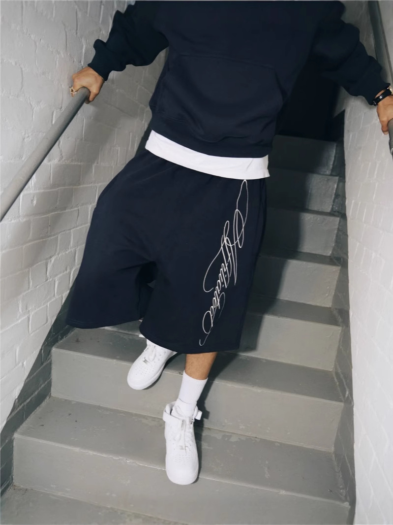 American Retro Europa y Estados Unidos Calle transfronteriza hip-hop verano bordado pantalones cortos sueltos casuales de moda pantalones cortos hombres