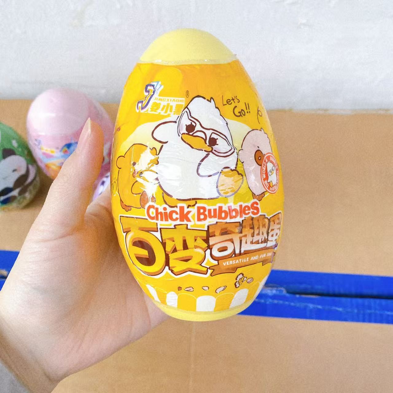 Juguetes para niños huevos de plástico de color caja de dibujos animados divertida caja de regalo huevos ciegos regalos grandes al por mayor
