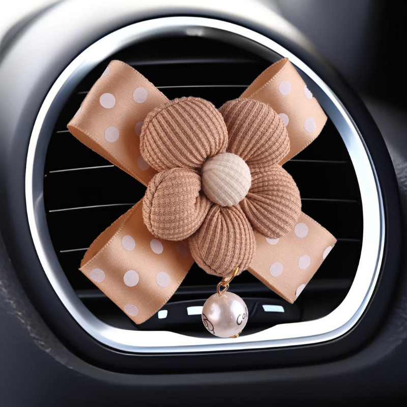 Nueva decoración de coche de aromaterapia de camelia creativa, decoración de salida de aire acondicionado de la consola central del coche de fragancia pequeña