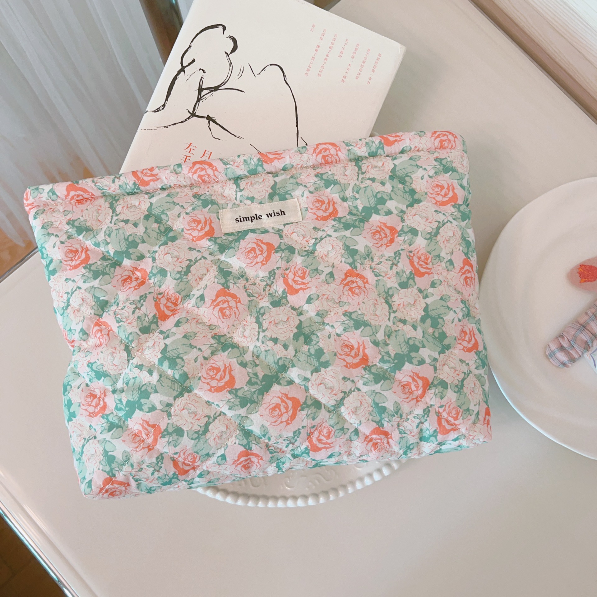 Green leaves and red roses