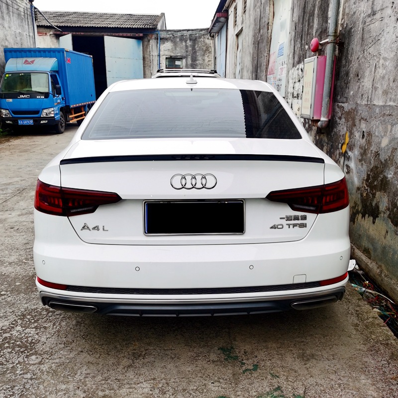 Suitable for Audi A4L, this S4-style small rear spoiler is a paint-applied ABS rear diffuser that can be installed without drilling holes, providing a streamlined and aerodynamic look