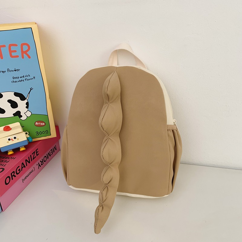 Mochila infantil transfronteriza de dibujos animados lindos dinosaurios cola mochila para niños y niñas jardín de infantes pequeña clase mochila para niños