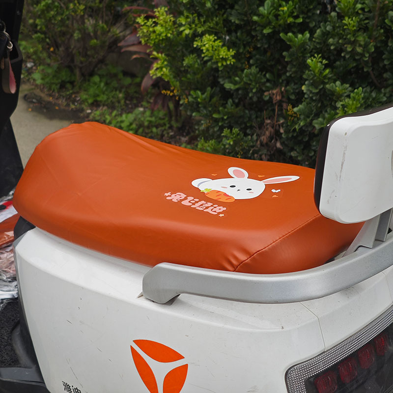 Electric Motorcycle Brown Elastic Leather Cartoon Seat Cushion Sunscreen and Rainproof Yadi Emma Table Bell Thickened Leather Seat Cover