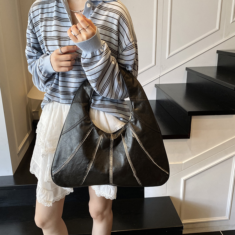 Bolsos retro para axilas para mujer 2025 nuevo bolso de hombro de nicho casual de todo fósforo bolso de viaje portátil de alta gama de moda