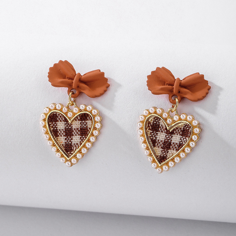 925 Silver Needle Vintage Pearl Fabric Love Heart Bow Tie Earrings European And American Ins Simple Autumn And Winter Check Graceful Earrings display picture 2