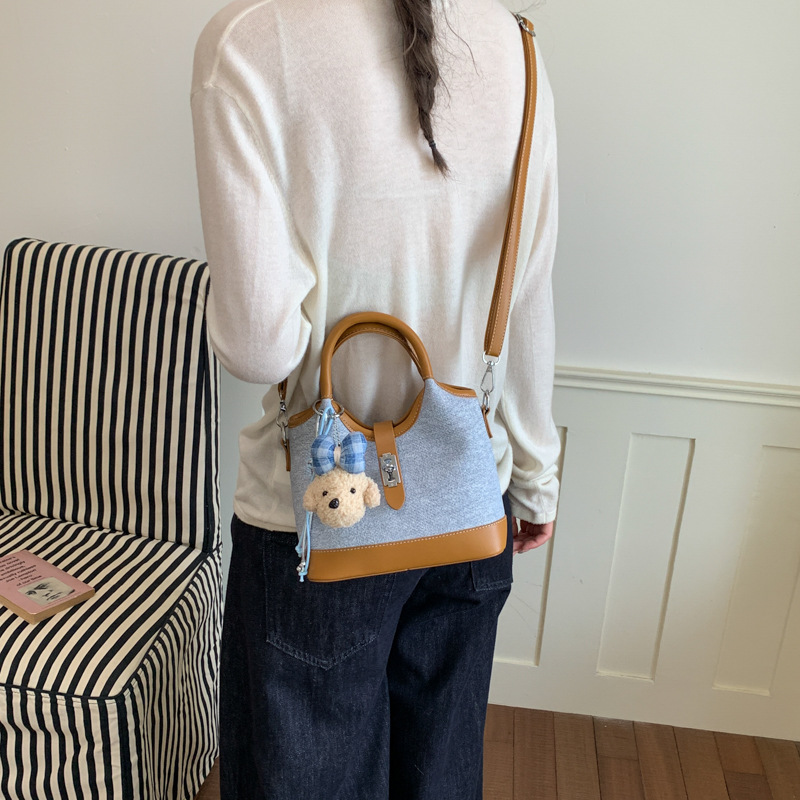 Bolsa de mano de color chocante para mujeres 2026 nueva moda versátil bolso de cubo de verano mochila de viaje