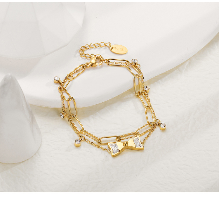 Mode Zirkon Intarsien Bogen Anhänger 14k Gold Überzogene Titan Stahl Armband display picture 1