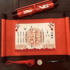 特別価格の赤い本のクロスボーダーの婚約書の巻物の下で結納します。