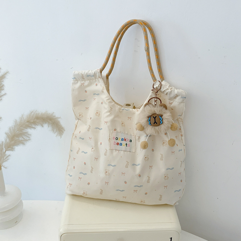 Japonés lindo y suave estudiante de gran capacidad bolso de hombro de mujer versión coreana pequeña fresca impresión de chicas bolsas de compras portátiles