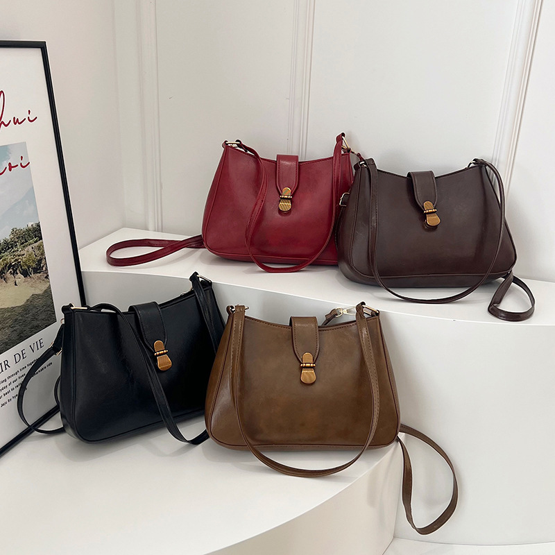 Nichezhong retro simple bolso de brazo bolso de mujer 2025 primavera nueva moda bolso pequeño de viaje de moda mochila de hombro