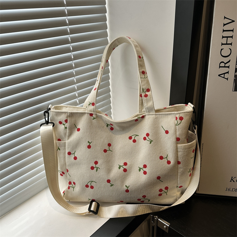 Este año, la popularidad de la bolsa de alto valor de la cara de 2025, primavera y verano, nueva moda, bolsa de hombro de gran capacidad, bolsa de ocio image 1