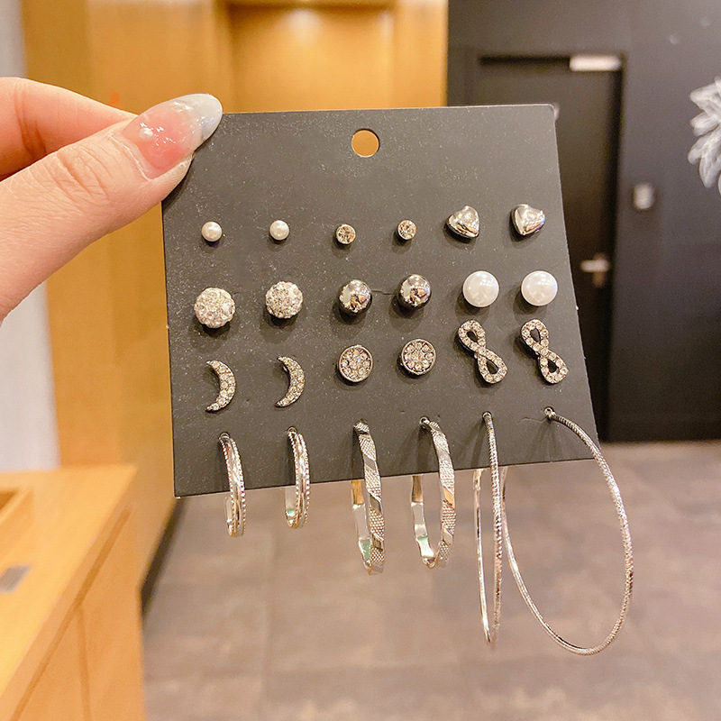 Pendientes de aleación Pendientes de alta calidad de perlas para mujer Pendientes exagerados de temperamento de lujo ligero coreano Pendientes largos con borlas al por mayor