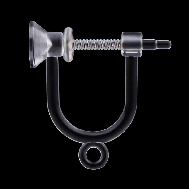 There is a needle and a drill on one end and a hanging resin spring ear clip under the cup [without spring]