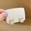 Small design earrings from pearl with bow, light luxury style, 2022 collection